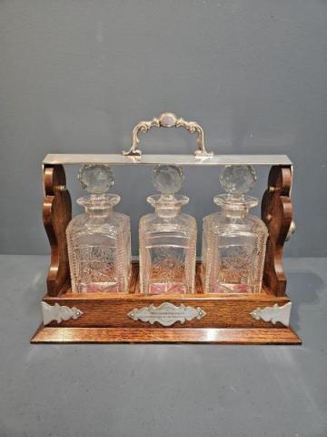 Antique Edwardian Oak and Silver Plated 3 Bottle Tantalus Cut Crystal Decanters at Sturmans Antiques tantalusess for sale