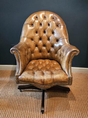 Antique Deep Buttoned Leather Revolving and Rocking Chair at Sturmans Antiques Furniture for sale 